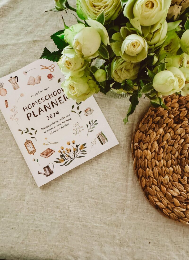 Homeschool planner with vase of flowers