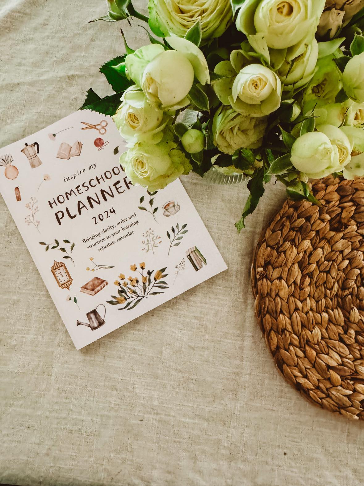 Homeschool planner with vase of flowers
