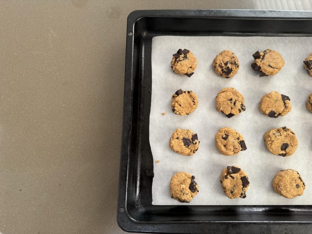 Delicious eggless choc chunk cookies: cookies formed and about to go into the oven to be baked.