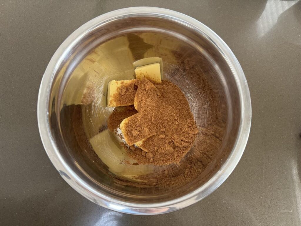 Delicious eggless choc chunk cookies: add butter and coconut sugar to bowl.