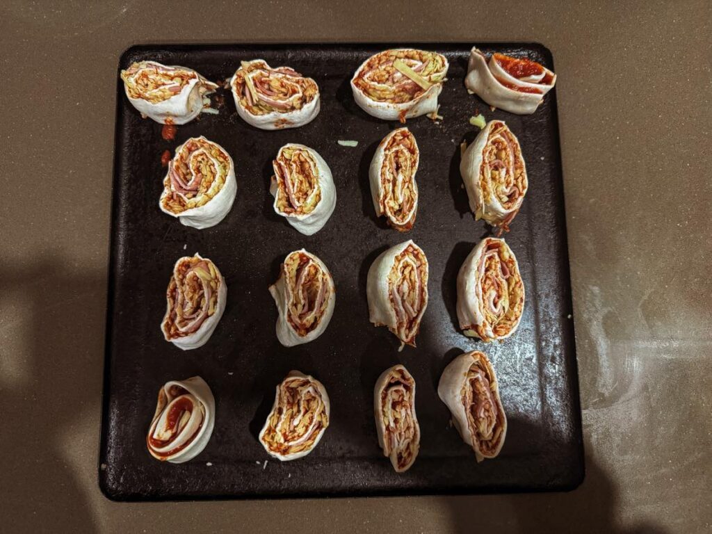 Super simple and delicious pizza scrolls for kids ready to bake