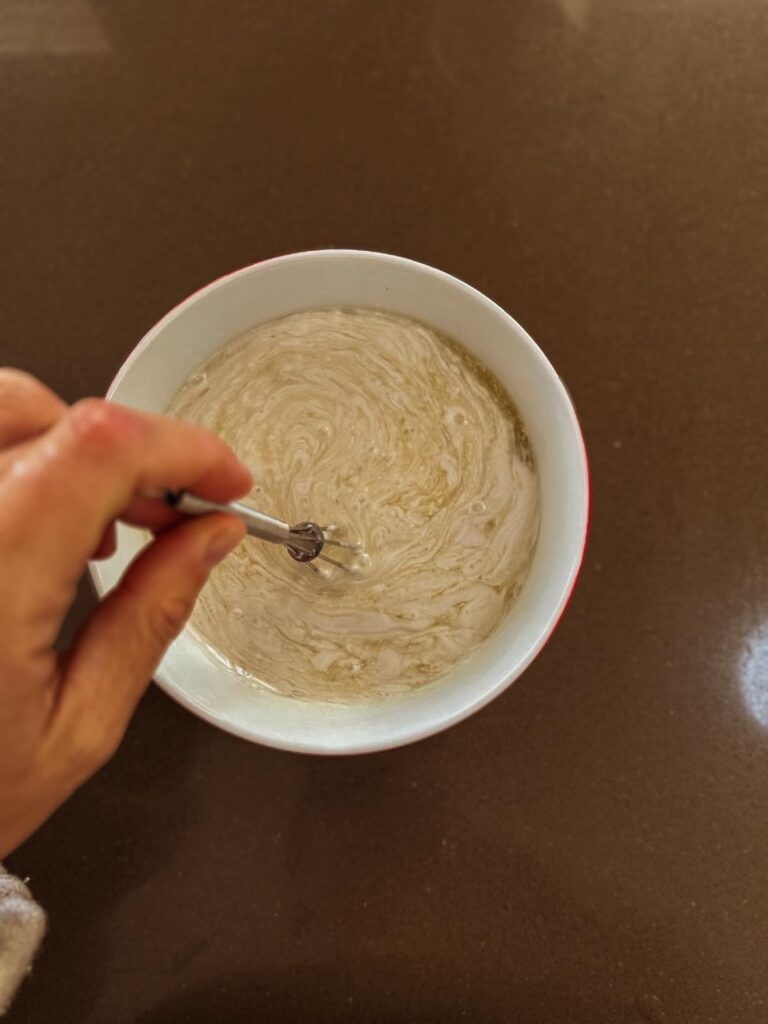 Fruity Gelatin Gummies for Kids' Wellness; whisk pineapple juice and coconut milk together.