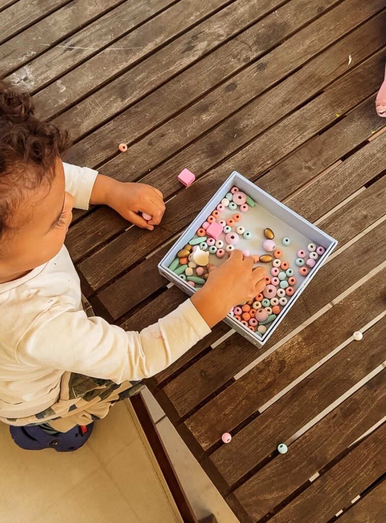 A day in the life of an Australian homeschooling family: my son playing with beads