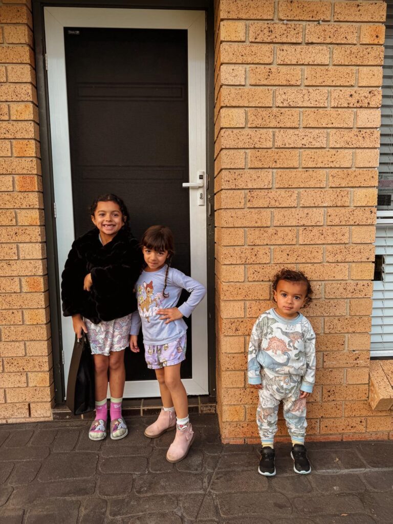 7 FAQ about our homeschool life in Australia: three kids in front of our home.