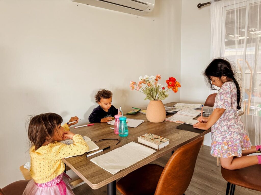 How to create a calm homeschool day: my children colouring together.