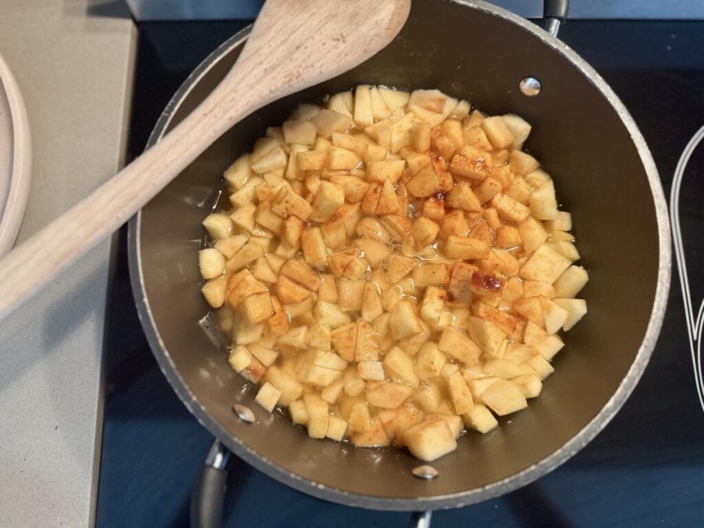 Healthy Homemade applesauce for kids: simmer apples over medium heat for 20 minutes